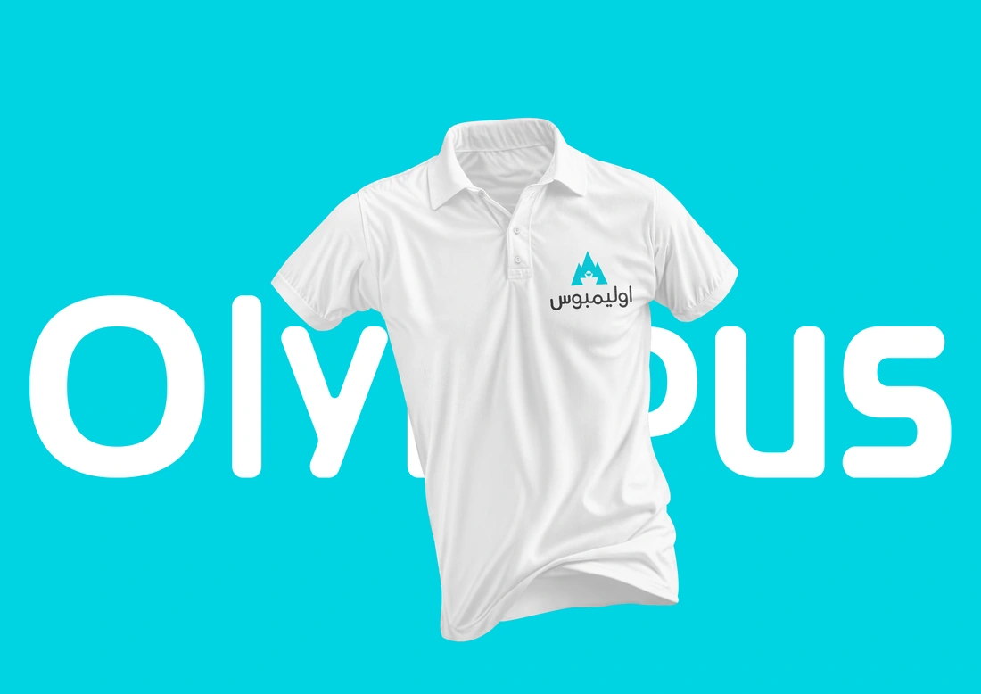 White Olympus polo shirt with the Arabic brand identity against a turquoise background